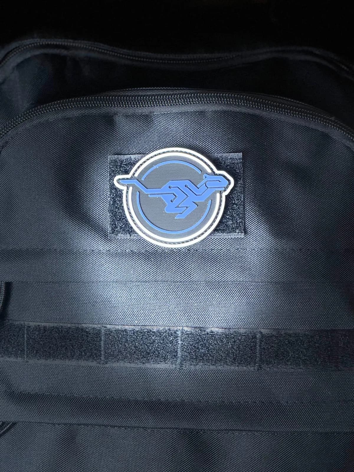 Maskottchen-Patch an einer Tasche